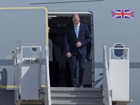 Britain's Prince William disembarks from a Royal Air Force plane after landing at the Marka airport in Amman, Jordan, Sunday, June 24, 2018. Britain's Prince William has kicked off a politically delicate five-day tour of Jordan, Israel and the Palestinian territories. He plans to meet with young people, refugees and political leaders in a tumultuous region Britain had controlled between the two world wars.