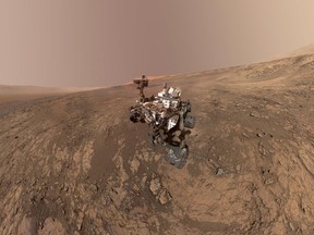 FILE - This composite image made from a series of Jan. 23, 2018 photos shows a self-portrait of NASA's Curiosity Mars rover on Vera Rubin Ridge. On Thursday, June 7, 2018, scientists said the rover found potential building blocks of life in an ancient lakebed and confirmed seasonal increases in atmospheric methane. The rover's arm which held the camera was positioned out of each of the dozens of shots which make up the mosaic. (NASA/JPL-Caltech/MSSS via AP)