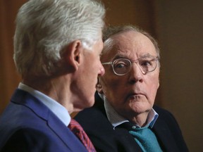 In this Monday, May 21, 2018, photo, former President Bill Clinton, left, and author James Patterson speak during an interview about their new novel, "The President is Missing," in New York.