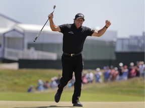 In this June 17, 2018, file photo, Phil Mickelson reacts after sinking a putt on the 13th hole during the final round of the U.S. Open Golf Championship, in Southampton, N.Y. Mickelson brought attention to a tough setup on Saturday when he intentionally hit a putt with the ball still rolling and was penalized.