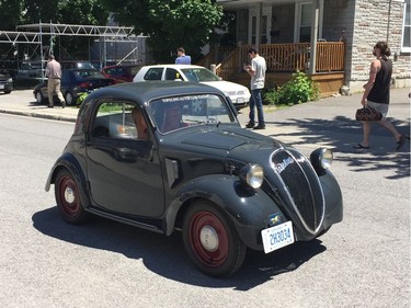 A vintage Fiat makes its way down Beech Street during Italian Week.