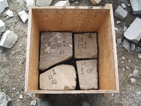 This removable plywood form holds stones ready for mortar. The top of the form marks the final height of the stone pier and gets removed after the pier is complete.