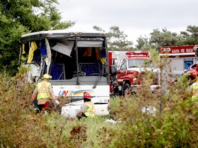 Firefighters and police officers respond to a serious collision involving a bus west of Prescott on Highway 401 on Monday, June 4, 2018 near Prescott.