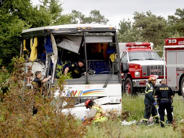 Police and firefighters respond to a serious collision involving a passenger bus west of Prescott on Highway 401 on Monday, June 4, 2018 near Prescott, Ont. (MARSHALL HEALEY/Special to The Recorder and Times)