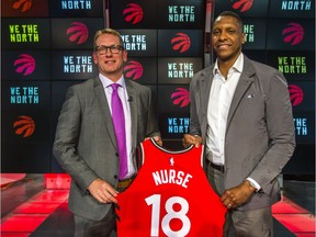 New Raptors head coach Nick Nurse, left, poses for photos with team president Masai Ujiri in Toronto on Thursday. Ernest Doroszuk/Postmedia