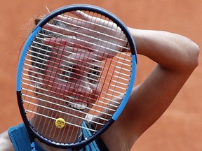 Madison Keys of the U.S. waves as she defeats Romania's Mihaela Buzarnescu after their fourth round match of the French Open tennis tournament at the Roland Garros stadium, Sunday, June 3, 2018 in Paris. Keys won 6-1, 6-4.