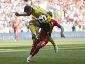 Belgium's Jan Vertonghen, top, and Tunisia's Wahbi Khazri challenge for the ball during a Group G match at Moscow on Saturday.