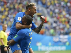 Neymar, top, celebrates with Douglas Costa after scoring Brazil's second goal during Friday's Group E match against Costa Rica in St. Petersburg.