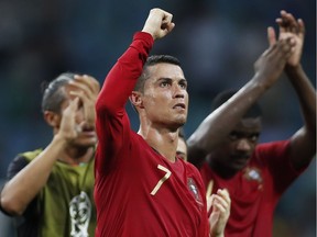 Portugal's Cristiano Ronaldo gestures to the fans at the end of Friday's World Cup Group B match against Spain in Sochi on Friday.