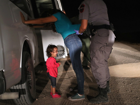 The crying Honduran girl on the cover of Time was not separated from her mother, father says