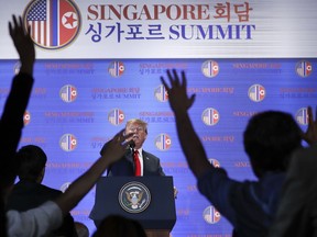 U.S. President Donald Trump answers questions about the summit with North Korea leader Kim Jong Un during a press conference at the Capella resort on Sentosa Island Tuesday, June 12, 2018 in Singapore.