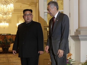 North Korean leader Kim Jong Un meets with Singapore's Prime Minister Lee Hsien Loong at the Istana or presidential palace on Sunday, June 10, 2018, in Singapore.