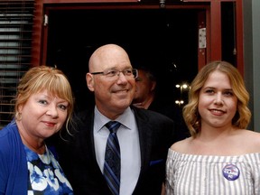 Leeds-Grenville-Thousand Islands and Rideau Lakes MPP-elect Steve Clark enters the Progressive Conservative victory party at Brockville's Boston Pizza on Thursday night with his wife, Deanna, left, and daughter Caitlin. (RONALD ZAJAC/The Recorder and Times)