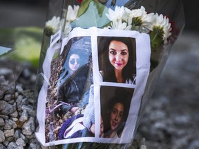 Outside of the abandoned building where the body of homicide victim Tess Richey was found, her memory is honoured by cards, candles, flowers and memorabilia near the corner of Church St. and Wellesley St. E. in Toronto, Ont. on Saturday December 2, 2017.