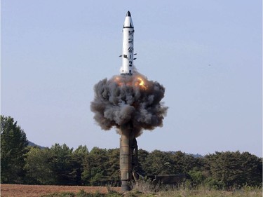 FILE - In this undated file photo distributed by the North Korean government on May 22, 2017, a solid-fuel "Pukguksong-2" missile lifts off during its launch test at an undisclosed location in North Korea. U.S. President Donald Trump's comments after his summit with North Korean leader Kim Jong Un that North Korea is destroying a major missile engine testing site seems to support a recent U.S. study that the country was razing a facility crucial to its development of mid-range solid-fuel missiles including the "Pukguksong-2." (Korean Central News Agency/Korea News Service via AP, File) ORG XMIT: BKWS308