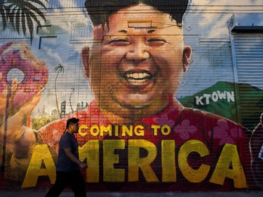 A man walks past a mural depicting North Korean leader Kim Jong Un, Monday, June 11, 2018, in Los Angeles. President Donald Trump and Kim came together for a momentous summit Tuesday that could determine historic peace or raise the specter of a growing nuclear threat, with Trump pledging that "working together we will get it taken care of."