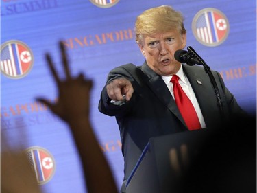 U.S. President Donald Trump answers questions about the summit with North Korea leader Kim Jong Un during a press conference at the Capella resort on Sentosa Island Tuesday, June 12, 2018 in Singapore. Trump's comments on Tuesday that North Korea was destroying a major missile engine testing site seemed to support a recent U.S. study that the country was razing a facility that had been crucial to its development of mid-range solid-fuel missiles.