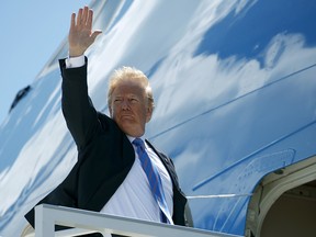 President Donald Trump boards Air Force One for a trip to Singapore to meet with North Korean leader Kim Jong Un, Saturday, June 9, 2018, at Canadian Forces Base Bagotville, in Canada.