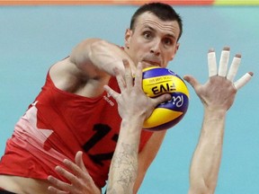 Gavin Schmitt spikes the ball in Canada's game against Italy during the 2016 Olympic Games at Rio de Janeiro. Schmitt announced his retirement from the team, but returned this year for Volleyball Nations League.