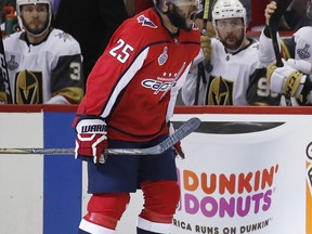 Washington Capitals forward Devante Smith-Pelly (25) celebrates his goal as he skates past the Vegas Golden Knights bench during the first period in Game 4 of the NHL hockey Stanley Cup Final, Monday, June 4, 2018, in Washington.