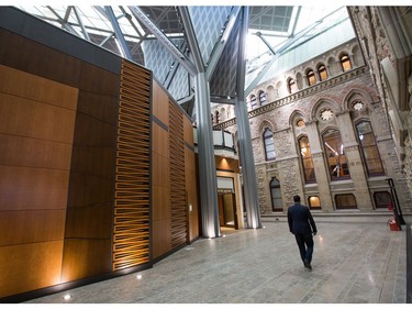 The new House of Commons on the left has been been built inside the courtyard of the historical building on the right as the media gets a tour of the West Block on Parliament Hill to observe the construction as it begins to near the end and Members of Parliament will begin sitting in the new House of Commons sometime in January 2019. Photo by Wayne Cuddington/ Postmedia