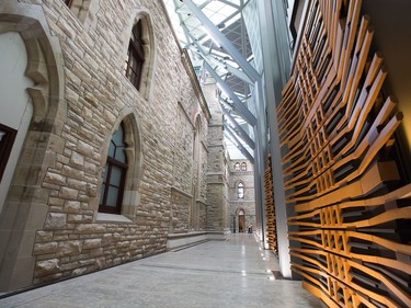 The new House of Commons on the right has been been built inside the courtyard of the historical building on the left   as the media gets a tour of the West Block on Parliament Hill to observe the construction as it begins to near the end and Members of Parliament will begin sitting in the new House of Commons sometime in January 2019. Photo by Wayne Cuddington/ Postmedia