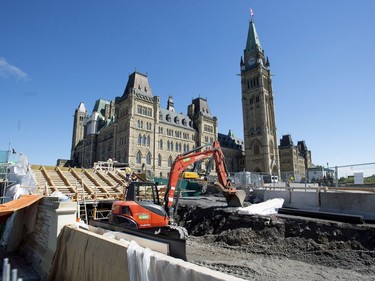 The Peace Tower is seen as work continues on the exterior of the future Visitor Welcome Centre during a media tour of the renovated West Block on Parliament Hill in Ottawa on Friday, June 15, 2018.