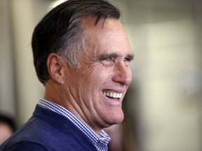 FILE - In this Feb. 16, 2018, file photo, former Republican presidential candidate Mitt Romney smiles as he greets students at Utah Valley University in Orem, Utah. Romney, the Republican presidential nominee in 2012, has dropped his harsh critique of Trump as he mounts a political comeback as a Senate candidate in Utah ahead of a June 26 primary.