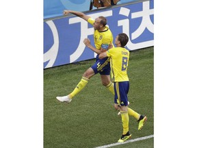 Sweden's Andreas Granqvist, above, and Albin Ekdalduring celebrates after scoring their side's first goal during the group F match between Sweden and South Korea at the 2018 soccer World Cup in the Nizhny Novgorod stadium in Nizhny Novgorod, Russia, Monday, June 18, 2018.