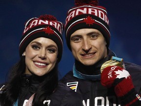 Gold medalists in the ice dance, free dance figure skating Tessa Virtue and Scott Moir, of Canada, pose during their medals ceremony at the 2018 Winter Olympics in Pyeongchang, South Korea, Tuesday, Feb. 20, 2018.