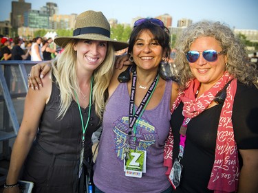 From left: Kelly Symes of the RBC Bluesfest programming team, backstage hospitality manager Sandra Monsieur, and volunteer coordinator of backstage services Isabelle Moroni.