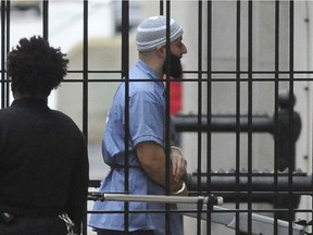 FILE - In this Feb. 3, 2016 file photo, Adnan Syed enters Courthouse East in Baltimore prior to a hearing.    A Maryland appeals court has upheld a ruling, Thursday, March 29, 2018,  granting a new trial to Syed, whose conviction in the murder of his high school sweetheart became the subject of the popular podcast "Serial." Syed was convicted in 2000 of killing Hae Min Lee and burying her body in a shallow grave in a Baltimore park. A three-judge panel on Thursday upheld a lower court ruling granting him new trial.
