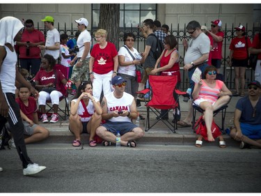 Canada Day celebrations took over the downtown core of Ottawa Sunday July 1, 2018. In the extreme heat people were flocking to all the shady spots they could find.   Ashley Fraser/Postmedia