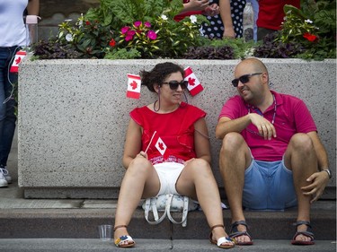 Canada Day celebrations took over the downtown core of Ottawa Sunday July 1, 2018. In the extreme heat people were flocking to all the shady spots they could find.   Ashley Fraser/Postmedia