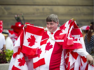 Canada Day celebrations took over the downtown core of Ottawa Sunday July 1, 2018. Noral Rebin was well decked out in Canada Day gear and Canada Flags Sunday.  Ashley Fraser/Postmedia