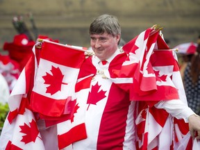 Noral Rebin was well decked out in Canada Day gear and Canadian flags on Sunday.  Ashley Fraser/Postmedia