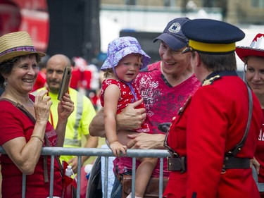 Canada Day celebrations took over the downtown core of Ottawa Sunday July 1, 2018. RCMP Commissioner Brenda Lucki greets spectators as she arrived on Parliament Hill for the noon show.   Ashley Fraser/Postmedia