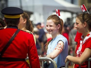Canada Day celebrations took over the downtown core of Ottawa Sunday July 1, 2018. RCMP Commissioner Brenda Lucki greets spectators as she arrived on Parliament Hill for the noon show.   Ashley Fraser/Postmedia