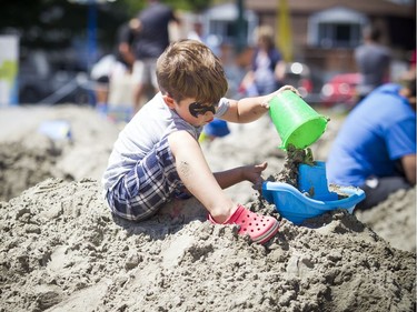 Four-year-old Jacob Borris enjoyed getting into the sand to play Saturday.