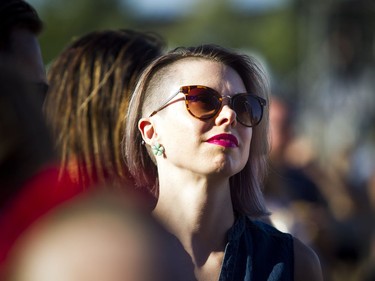 A woman watches Amos the Transparent from Ottawa at the City Stage Sunday July 8, 2018, at RBC Bluesfest.