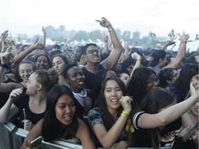 Fans watch the group Rae Sremmurd perform at Bluesfest in Ottawa on Saturday, July 14, 2018.