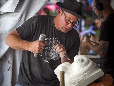 Danny Barber works away on his carving during the 2018 Canadian Stone Carving Festival that was taking place on Sparks Street Saturday July 21, 2018.