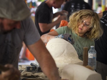 11-year-old Roxanne Maquet works away on her carving during the 2018 Canadian Stone Carving Festival that was taking place on Sparks Street Saturday July 21, 2018.