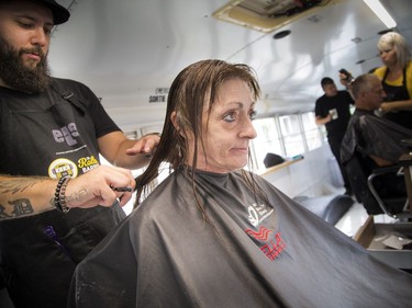 Anne Donovan, the founder, and Francois Thibeault co-founder, had the official launch of the Rolling Barber Sunday July 22, 2018 at the corner of Daly and King Edward. Lynn Kelly gets a haircut from Christopher Lord Sunday morning.