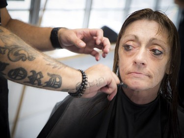 Anne Donovan, the founder, and Francois Thibeault co-founder, had the official launch of the Rolling Barber Sunday July 22, 2018 at the corner of Daly and King Edward. Lynn Kelly gets a haircut from Christopher Lord Sunday morning.