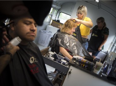 Anne Donovan, the founder, and Francois Thibeault co-founder, had the official launch of the Rolling Barber Sunday July 22, 2018 at the corner of Daly and King Edward. Joanne Mackenzie gets a haircut from Onneka Verriere Sunday morning.