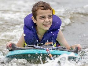Patrick Redmond, 9, participates in a SkiAbility Ottawa camp on the Rideau River on Tuesday, July 24, 2018.