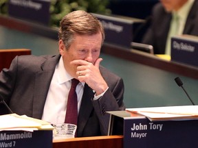 Mayor John Tory at City Council in the wake of Premier Doug Ford's announcement to to reduce city council to 25 wards in Toronto, Ont. on Friday July 27, 2018.