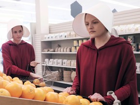 Alexis Bledel, Elisabeth Moss in The Handmaid's Tale not drinking wine.