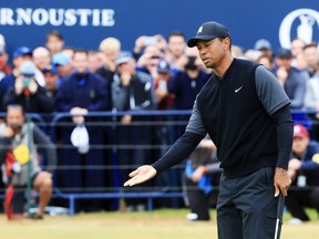 Tiger Woods of the United States reacts after missing a putt for birdie on the 18th green during the second round of the 147th Open Championship at Carnoustie Golf Club on July 20, 2018 in Carnoustie, Scotland.